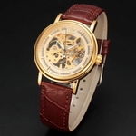 Relógio Sewor,a Corda,feminino,fundo dourado, pulseira Couro marrom,modelo speedmastei 0057